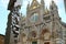 Siena Cathedral and sculpture by Helidon Xhixha. Facade Made with white and colored marble and stainless steel sculpture