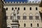 SIENA, ITALY - MAY 11, 2023: Palazzo Salimbeni palace, the Main Office or Headquarter of Monte dei Paschi Bank, with Statue of