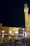 Siena by night. Piazza del Campo and Tower del Mangia illuminated.