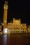 Siena by night. Piazza del Campo and Tower del Mangia illuminated.