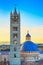 Siena sunset, Cathedral Duomo and Campanile tower landmark. Tuscany,