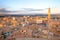 Siena sunset panoramic skyline. Mangia tower landmark. Tuscany,