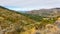 Sierra de Gredos mountain landscape with winding road, Spain.