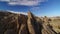 Sierra Nevada Mountains and Mt Whitney from Alabama Hills Desert and Rock Fins Aerial Shot Forward Elevate