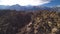 Sierra Nevada Mountains and Mt Whitney from Alabama Hills Desert and Rock Formation Aerial Shot Rotate Left