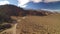 Sierra Nevada Mountains and Mt Whitney from Alabama Hills Desert and Rock Formation Aerial Shot Rotate Right