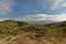 Sierra Nevada mountains under a blue sky one big grey cloud