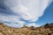 Sierra Wave cloud formation over desert rock formations