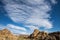 Sierra Wave cloud formation over desert rock formations