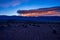 Sierra Wave lenticular cloud formation at sunrise above White Mountain range