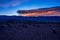 Sierra Wave sunrise cloud formation over mountain range silhouette