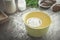 Sieve flour and flour on mixing bowl.