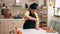 Sieving flour on wooden table