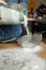 Sifting flour on wooden table