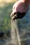 Sifting sands falling from a childs hand