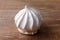 Sigh or homemade meringue is a sweet made from egg whites, sugar and lemon on the rustic kitchen wooden table