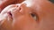 Sight of a newborn baby child`s eyes macro baby look close up shot