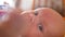 Sight of a newborn baby child`s eyes macro baby look close up shot