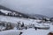 Sight to the foggy, snowy Landscape, the Gondula and Skiing Slopes of Churwalden, Switzerland in Wintertime