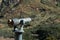 Sightseeing Binoculars Pointed Right Towards Mountain.