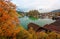 A sightseeing boat cruising on Konigssee  King`s Lake  surrounded by colorful autumn trees