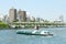 Sightseeing boat, Japan river, residential apartments , bridge