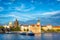 Sightseeing cruise boat on Vltava river with Charles Bridge on b