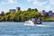Sightseeing tour boat sailing on st. Lawrence river and montreal cirtyscape background in Quebec, Canada