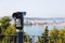 Sightseeing tourist coin operated telescope at watching point with scenic view at the port of Ancona, Italy