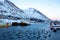 Siglufjordur harbor with fishing boats at dawn.