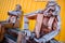 SIGLUFJORDUR, ICELAND - 15 August 2012: Sitting wooden statue with colorful background, Siglufjordur, Iceland