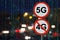 The Sign 5G no 4G and the night road with cars and data matrix