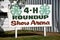 Sign advertising the 4-H show arena at a county fair