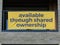 Sign advertising new apartments available through shared ownership