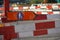 Sign for alternate route or deviation for pedestrian close up in a complex civil engineering site marked with many barrier planks