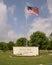 Sign and American Flag for `Heroes Park` honoring Arlington police and firefighters who have fallen in the line of duty.