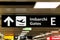 Sign arrow direction at airport indicating Gates
