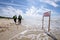 Sign of bathing prohibition in the empty Palanga beach. Text