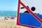 A sign on the beach is not allowed to swim! People bathe and rest on the sea in spite of the sign and ban