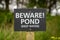 Sign: Beware! Pond deep water