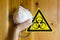 Sign of biological danger and biological weapons for warning inscriptions and respirator for protection against virus, dust and