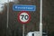 Sign at border of city of Wassenaar In the Netherlands with also speed sign in kilometers