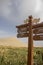 Sign for camel rides with dune and marsh, Singing Sand Mountain, Taklamakan Desert, Dunhuang, China