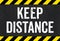 Sign with caution stripes - Keep distance