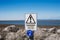 Sign - `Danger It Is Unsafe To Climb Or Walk On The Rocks` On Promenade