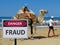 Sign dangerous scammers on the beach and camel riding children.