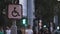 Sign of a disabled person sitting on a wheelchair against the background of blurred walking people. Concept idea