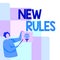 Sign displaying New Rules. Internet Concept recently one of a set of explicit or understood regulations Man Standing
