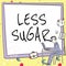 Sign displaying Less Sugar. Word for Lower volume of sweetness in any food or drink that we eat Man working on computer