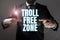 Sign displaying Troll Free Zone. Business overview Social network where tolerance and good behavior is a policy Man And